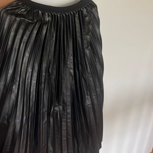 Faux leather skirt. Size 4/small. Available with tags